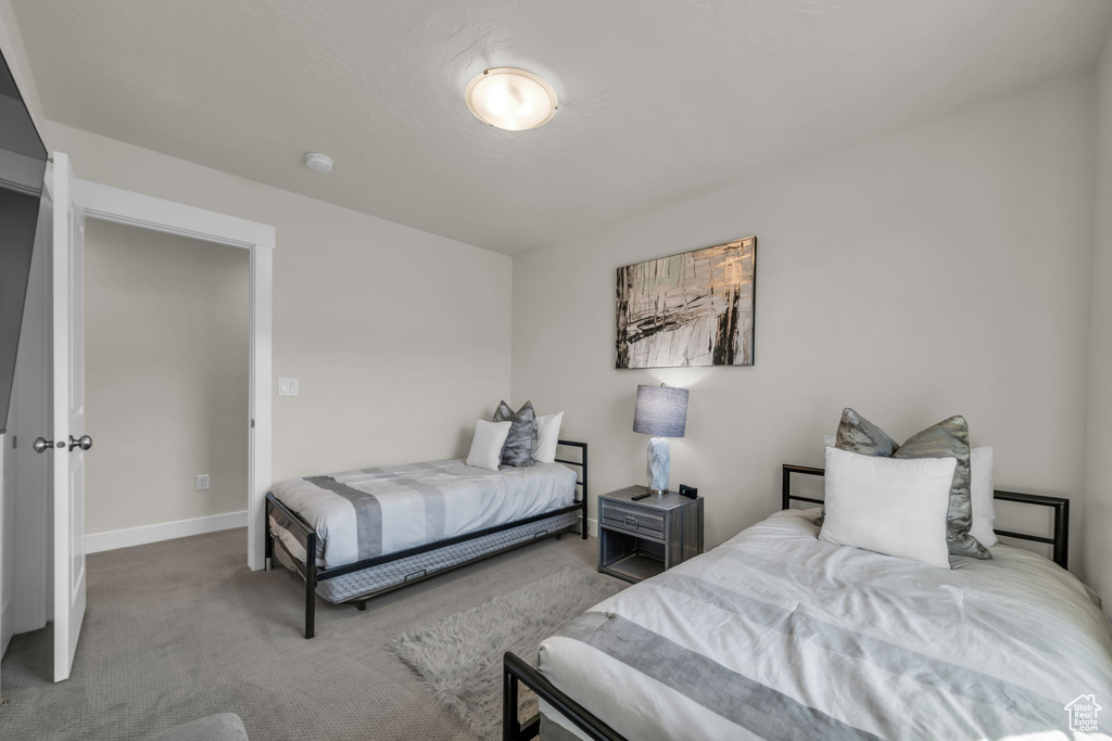 Bedroom with carpet and baseboards