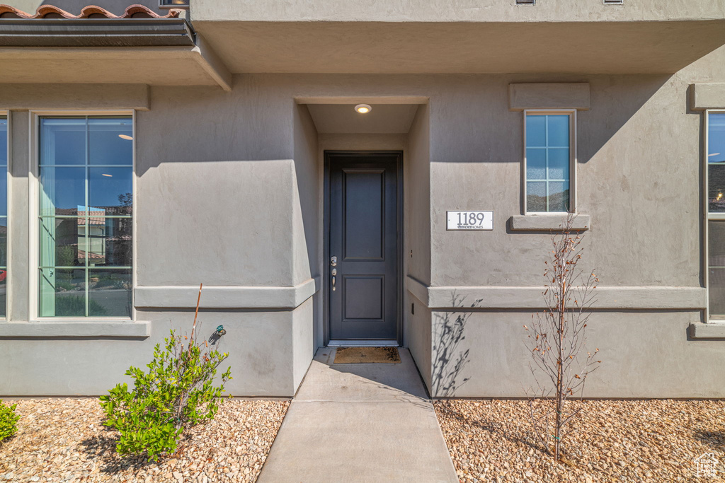 Doorway to property with stucco siding