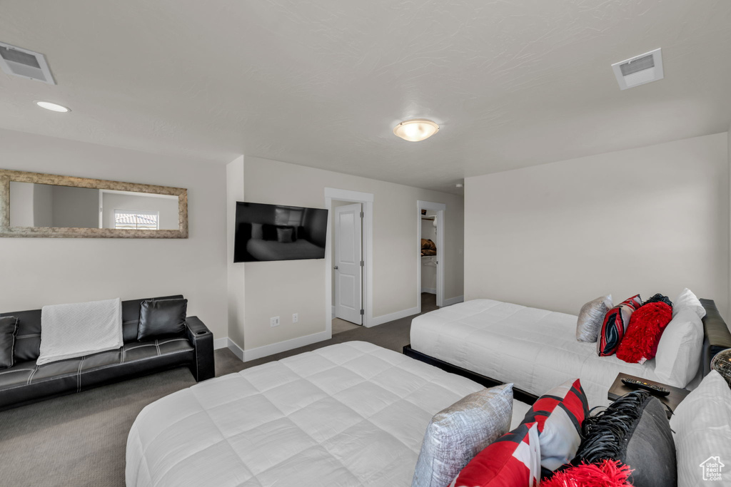 Carpeted bedroom with baseboards and recessed lighting