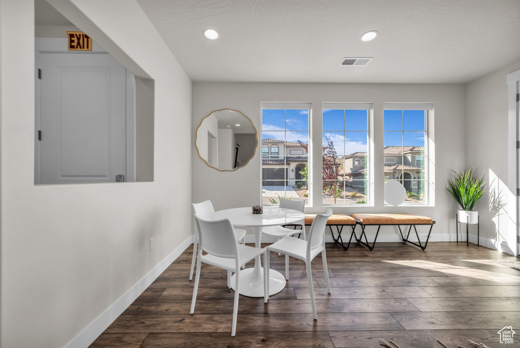 Dining room featuring hardwood / wood-style flooring, baseboards, and recessed lighting