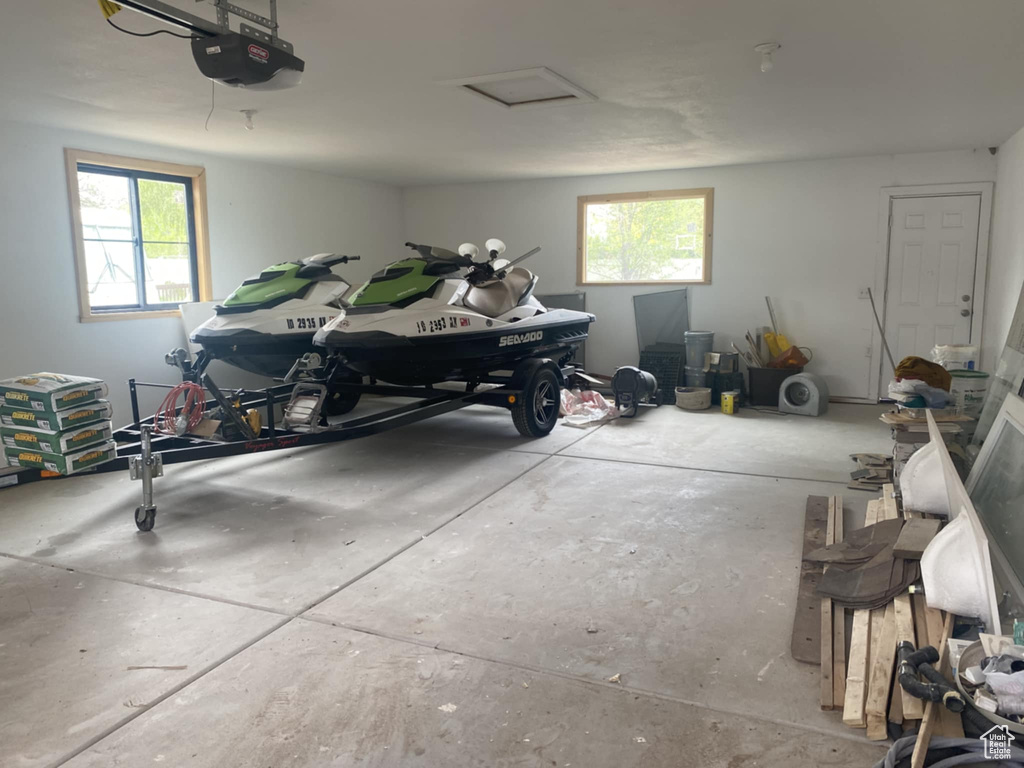 Garage featuring a garage door opener