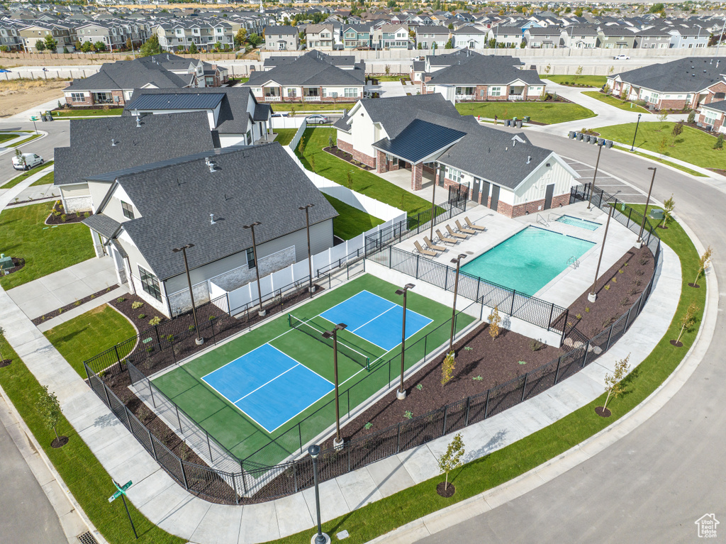 Aerial perspective of suburban area with a pool
