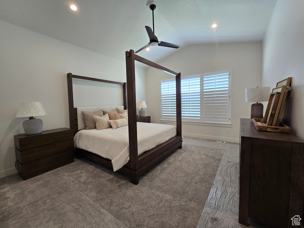 Carpeted bedroom featuring vaulted ceiling, baseboards, a ceiling fan, and recessed lighting
