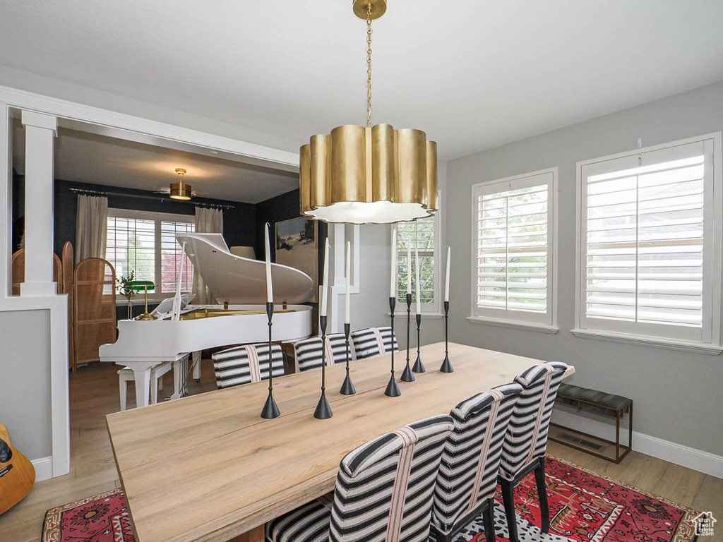Dining area with wood finished floors and baseboards