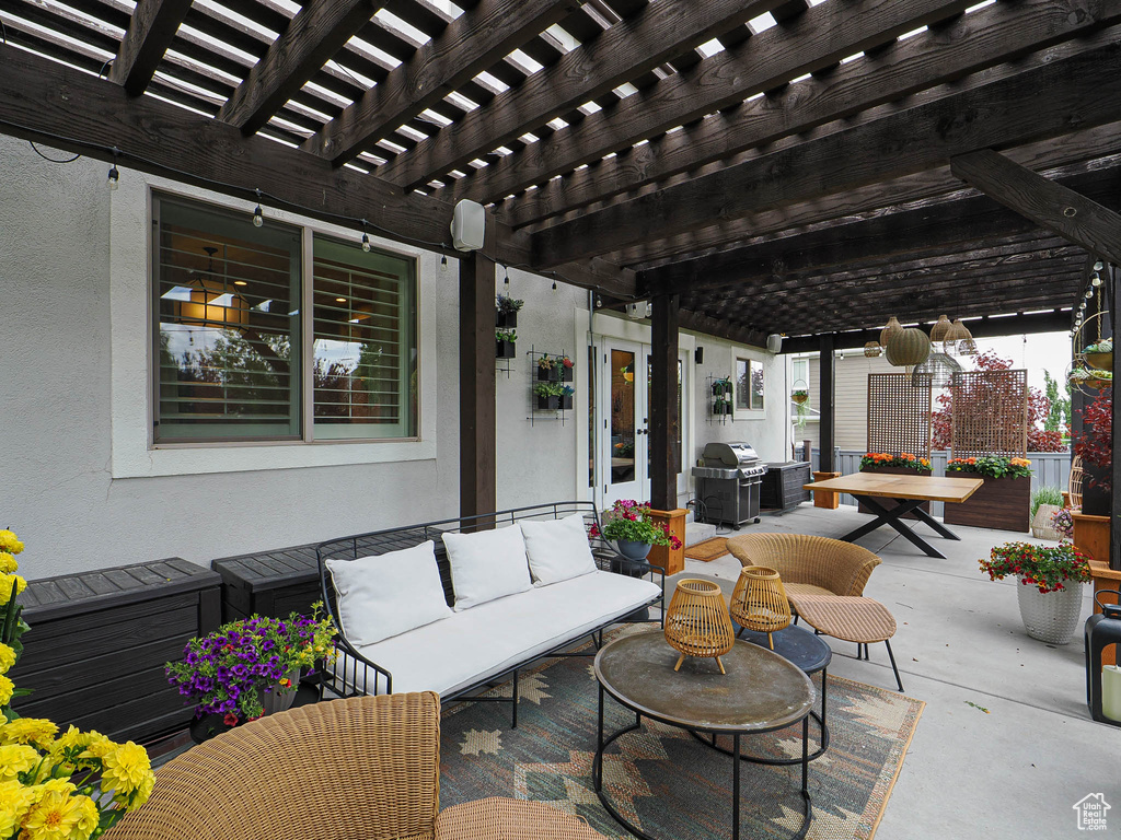 View of patio / terrace with an outdoor living space, area for grilling, a pergola, and outdoor dining space