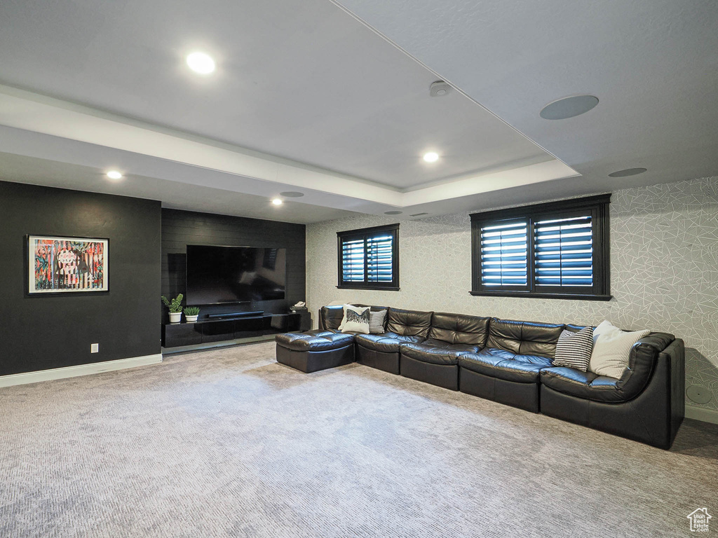 Carpeted living area featuring recessed lighting