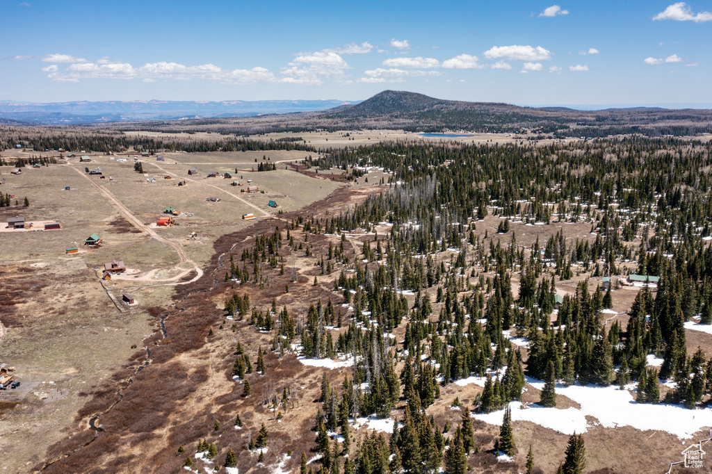 Aerial overview of property\'s location with a mountainous background