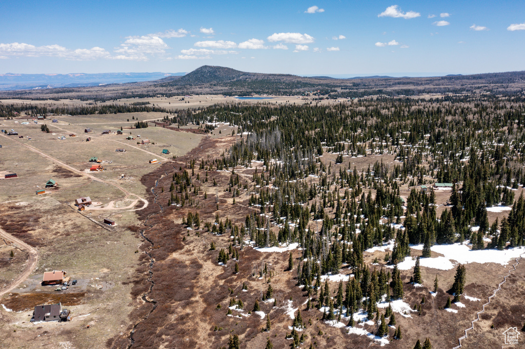 Aerial view of property\'s location featuring a mountain backdrop