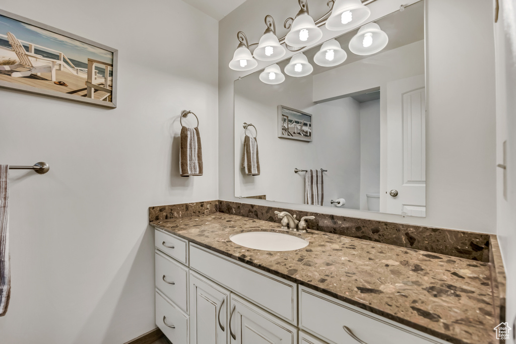 Bathroom with toilet and vanity