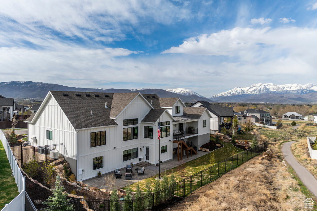 Aerial perspective of suburban area with a mountain backdrop