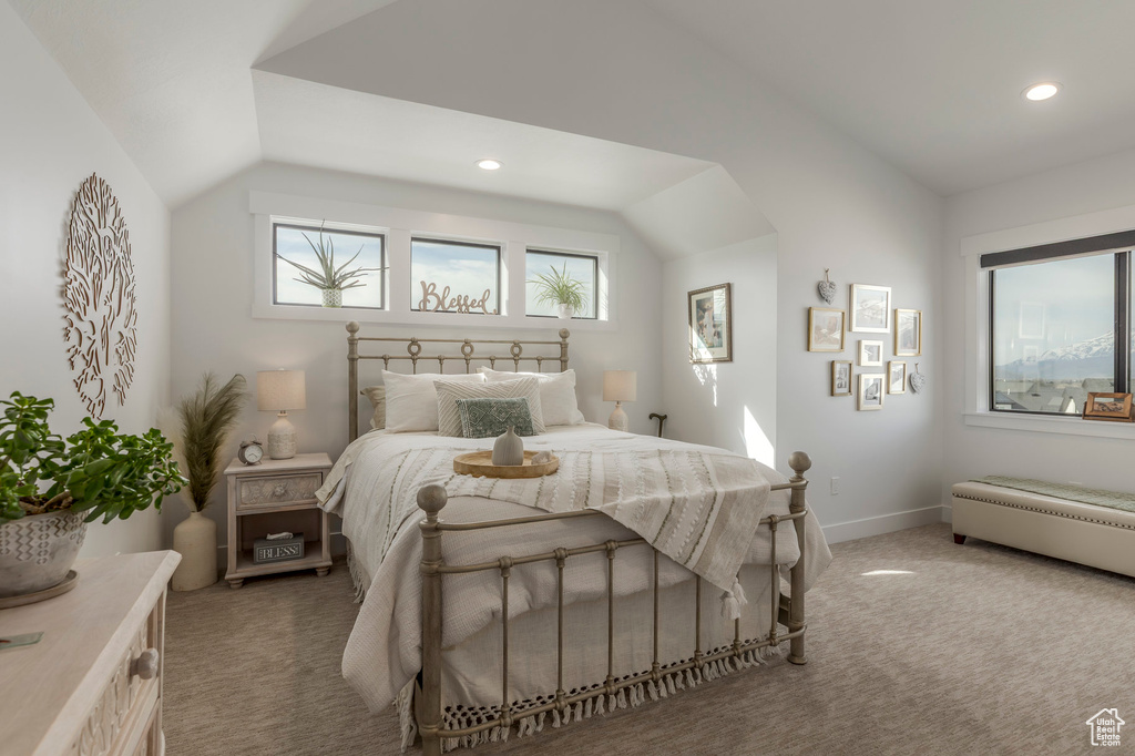 Bedroom featuring lofted ceiling, light colored carpet, recessed lighting, and baseboards