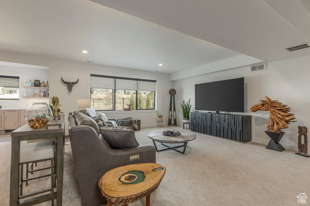Living room with carpet, recessed lighting, and baseboards