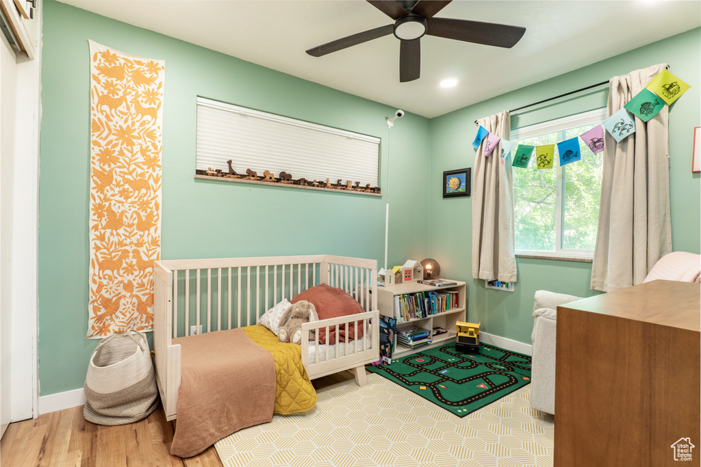 Bedroom featuring baseboards, recessed lighting, wood finished floors, and ceiling fan