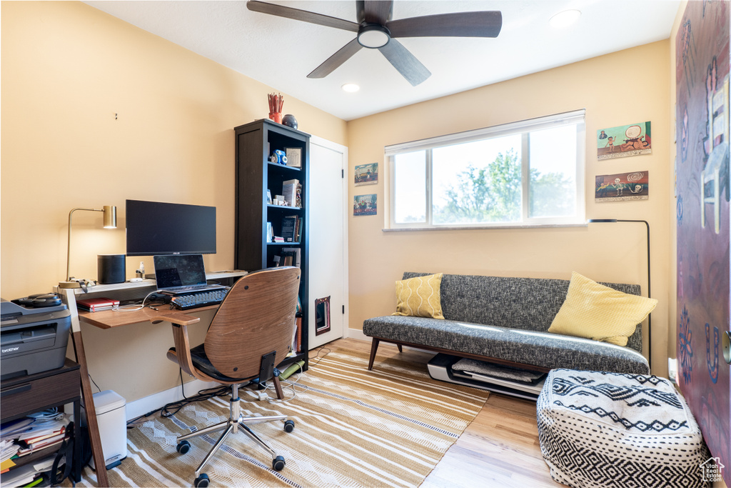 Office area featuring a ceiling fan, wood finished floors, recessed lighting, and baseboards