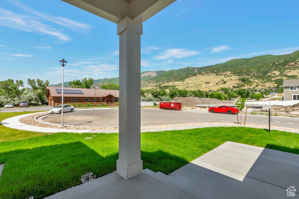 View of grassy yard featuring a mountain view