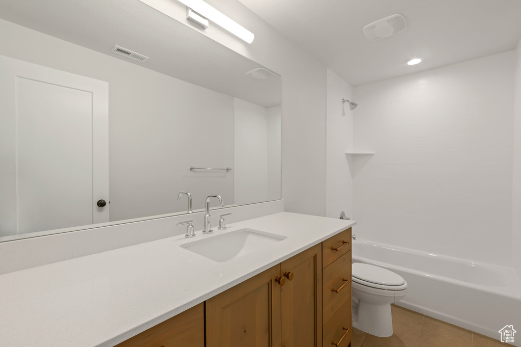 Full bathroom featuring vanity, tile patterned flooring, shower / washtub combination, and recessed lighting