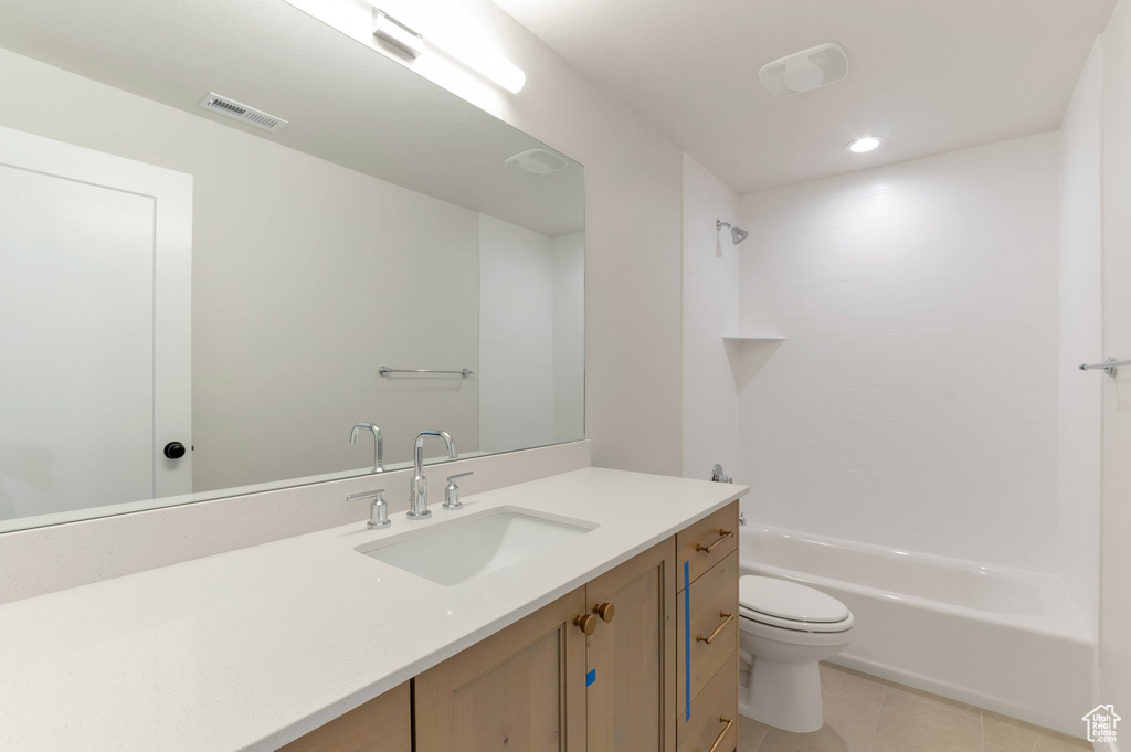 Full bathroom with toilet, tile patterned floors, vanity, shower / bathtub combination, and recessed lighting