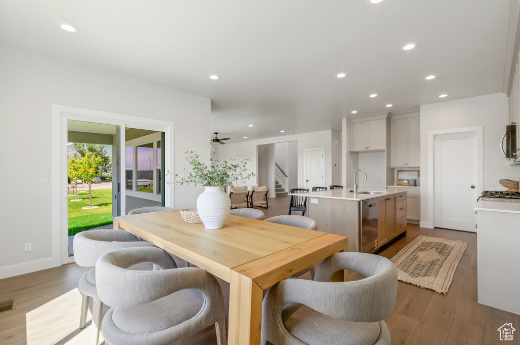 Dining space featuring stairs, recessed lighting, light wood finished floors, and a ceiling fan