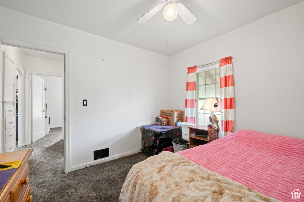 Bedroom featuring carpet floors, ceiling fan, and baseboards