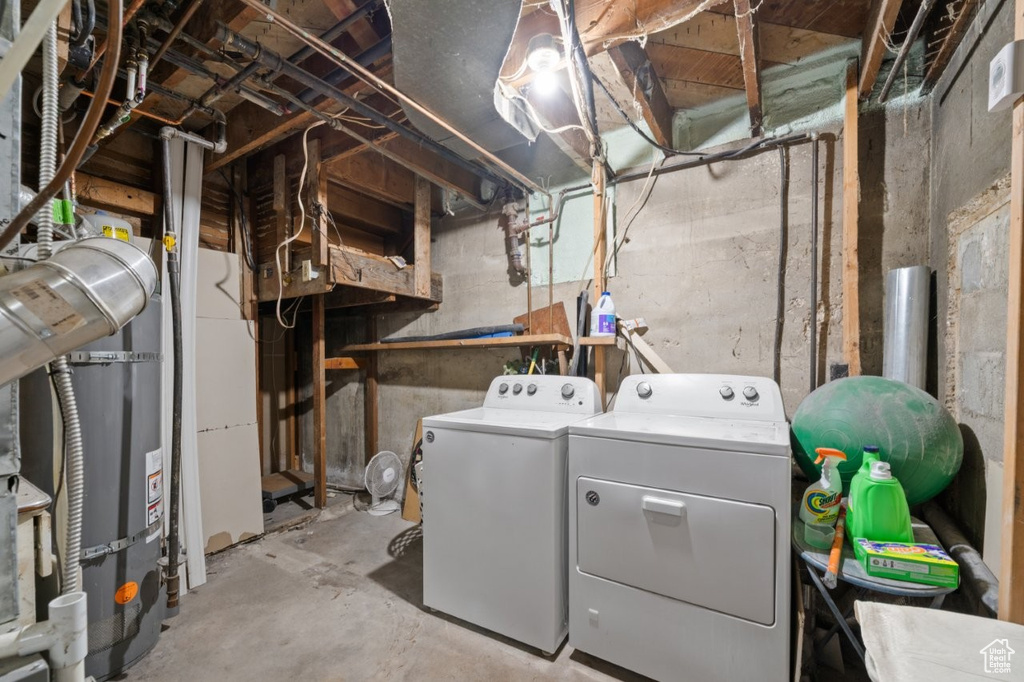 Unfinished below grade area with separate washer and dryer and secured water heater