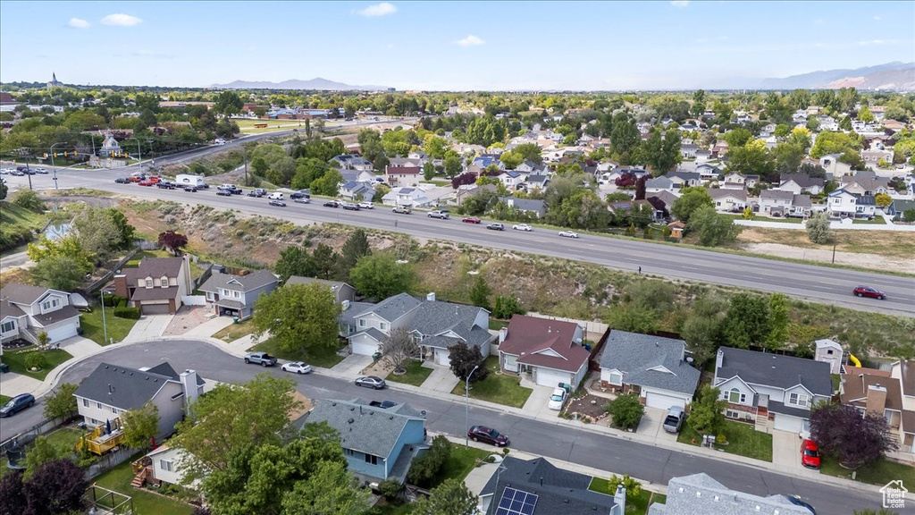 Aerial perspective of suburban area with a mountainous background