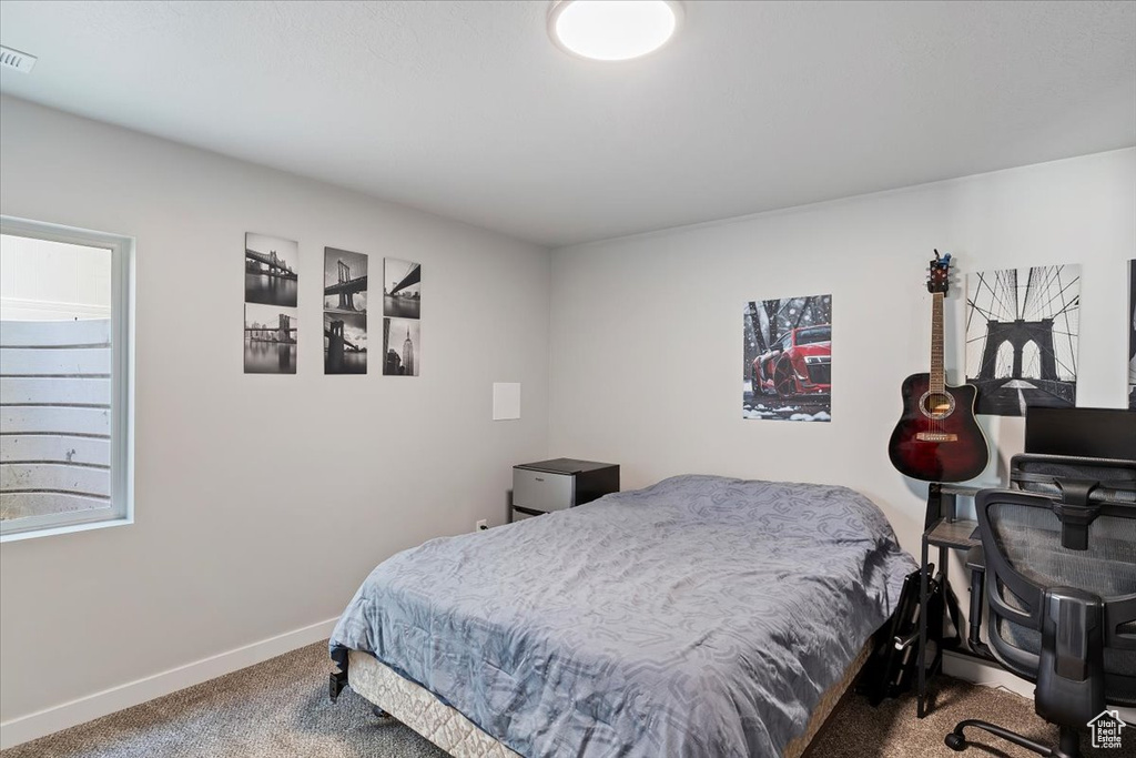 Carpeted bedroom with baseboards