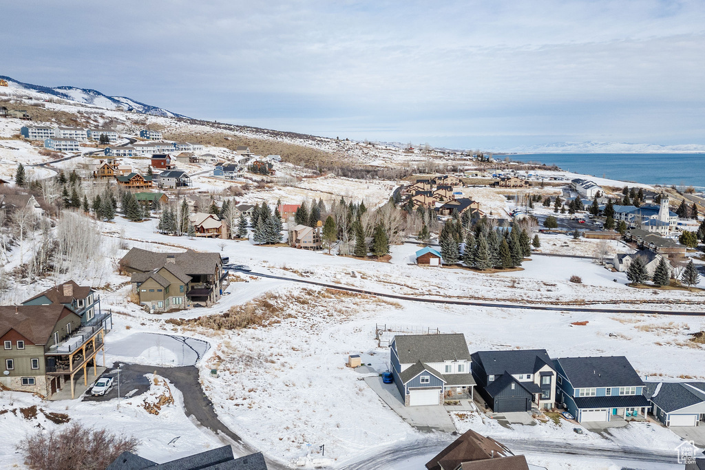 Snowy aerial view featuring a residential view