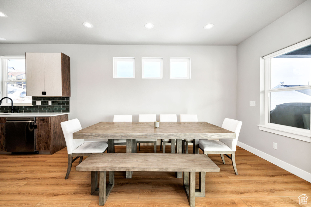 Dining space featuring recessed lighting, light wood finished floors, and baseboards