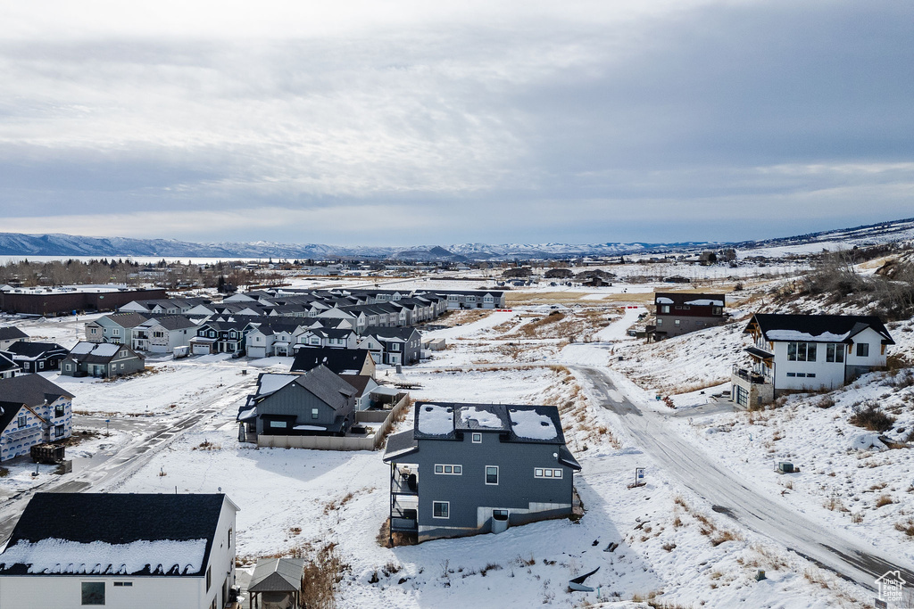 Snowy aerial view with a residential view