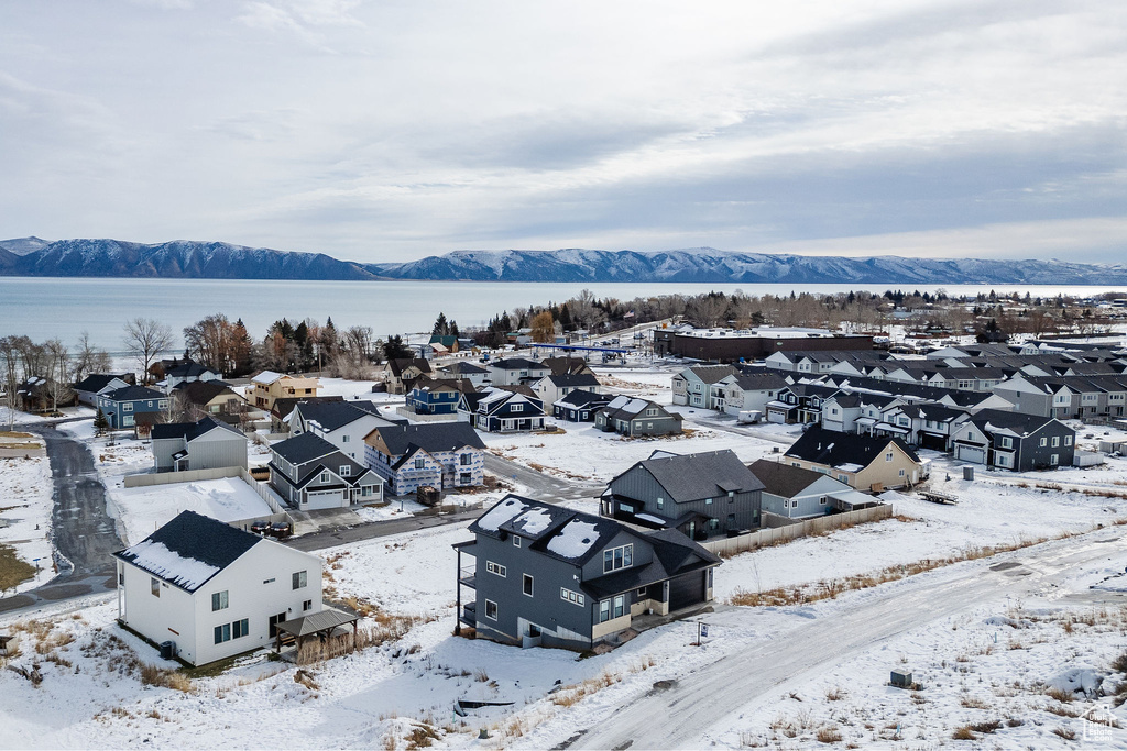 Aerial view of residential area featuring a water and mountain view