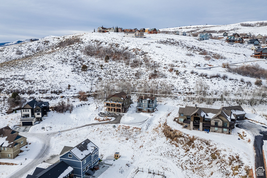 Snowy aerial view with a residential view