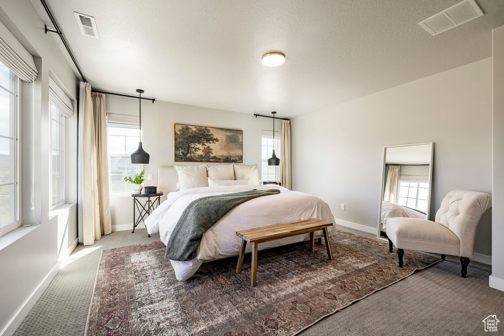 Carpeted bedroom with baseboards