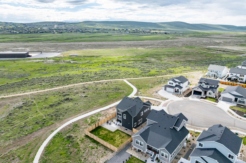 Aerial perspective of suburban area featuring a mountainous background