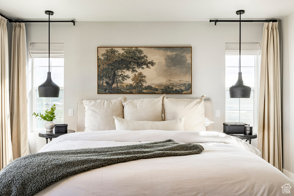 Bedroom with multiple windows