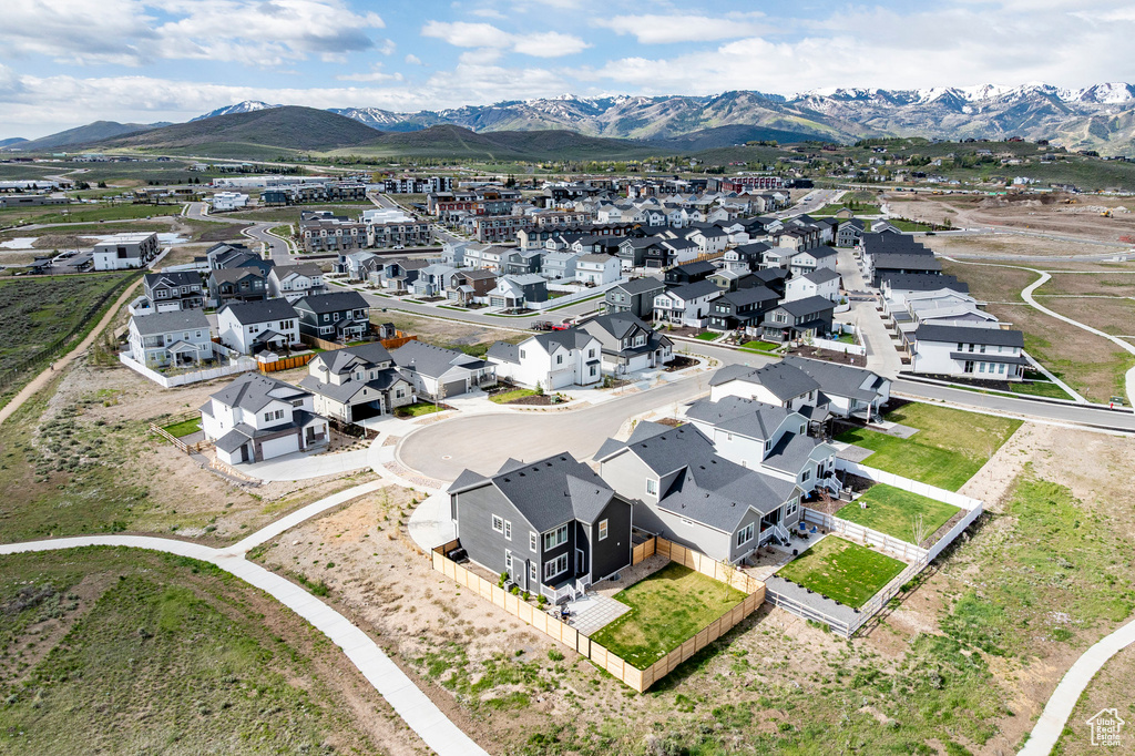 Aerial view of residential area featuring mountains