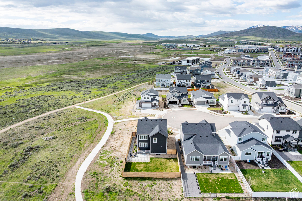 Aerial perspective of suburban area with a mountain backdrop