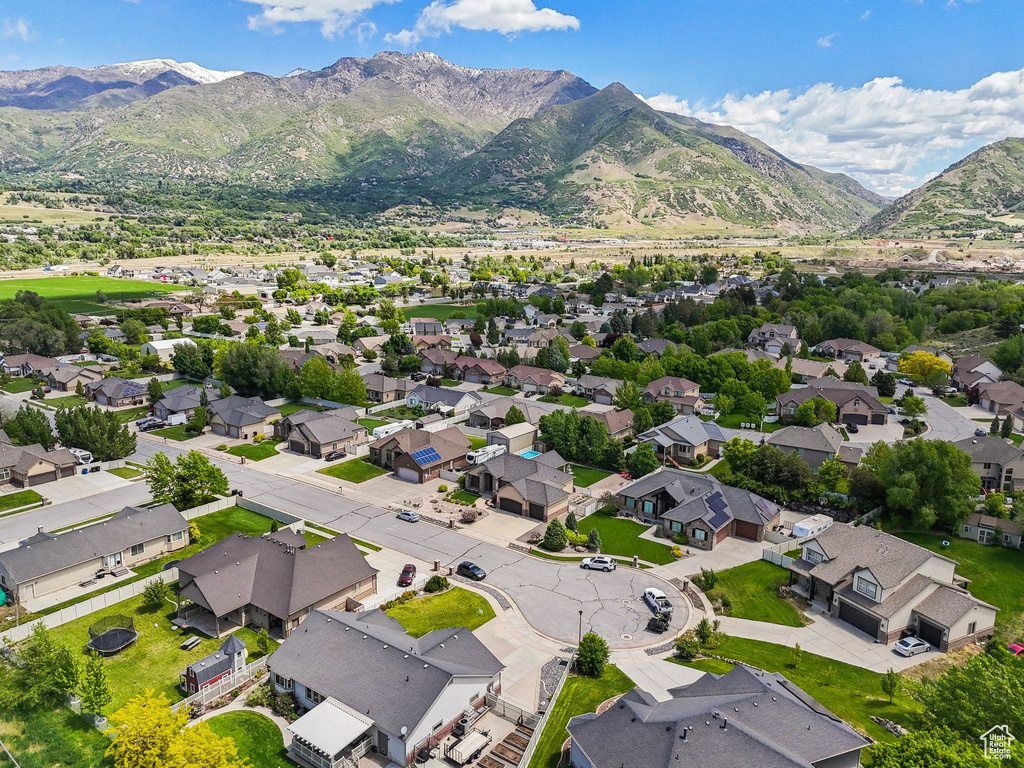 Aerial view of residential area featuring a mountain backdrop