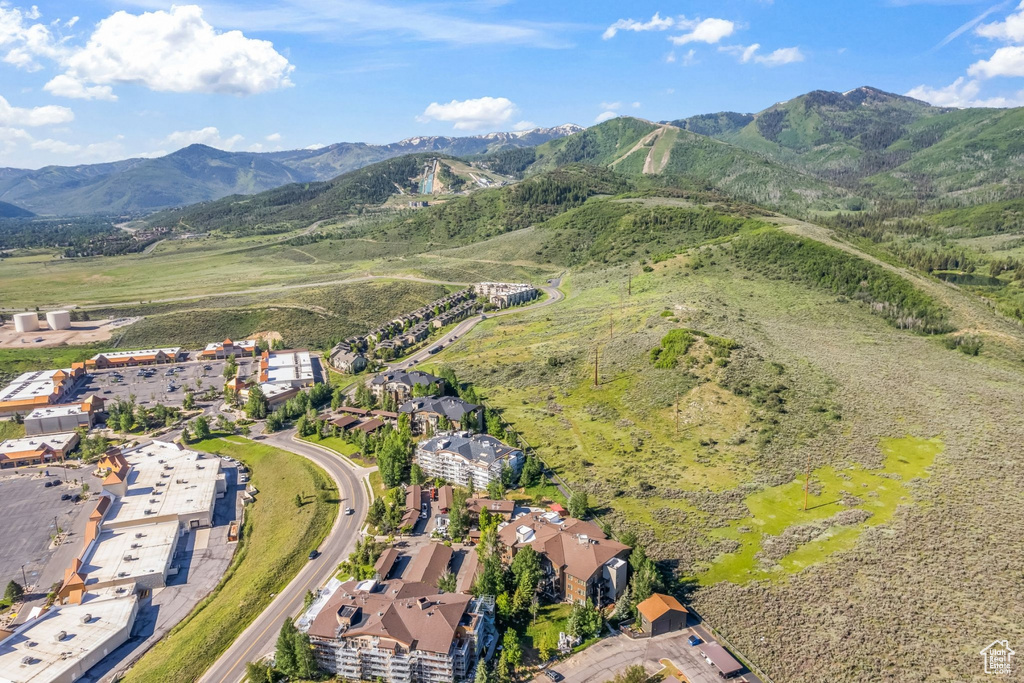 Aerial overview of property's location with a mountainous background