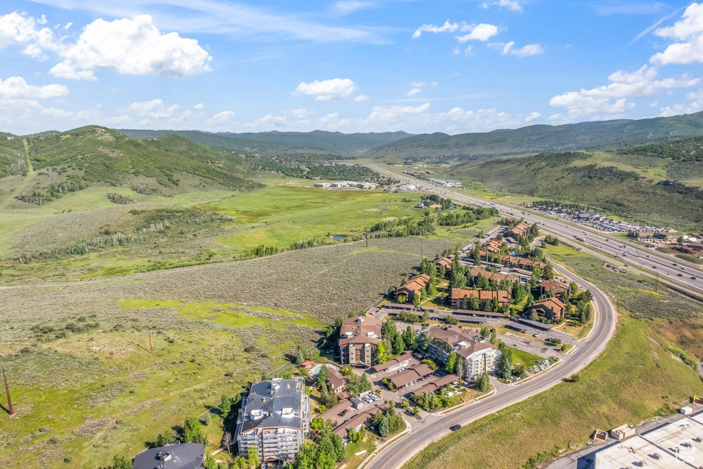 Aerial overview of property's location featuring a mountain backdrop