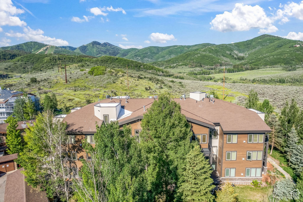 View of subject property featuring a mountainous background