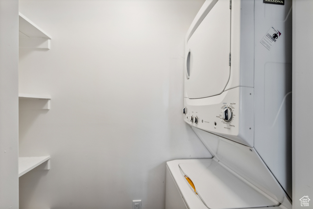 Washroom featuring estacked washer and dryer