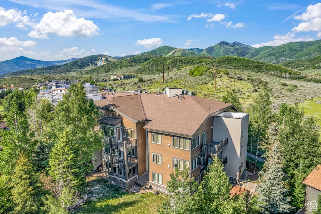 View of subject property featuring a mountain backdrop