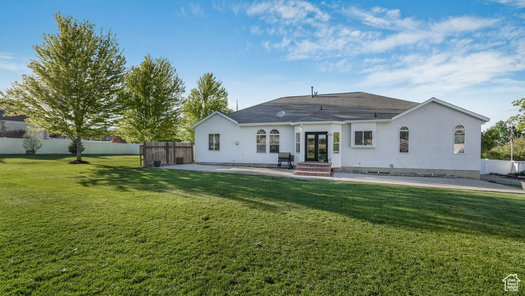 Back of house with a patio, french doors, stucco siding, and entry steps