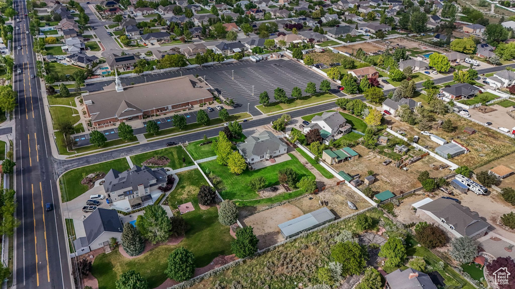 Aerial view of property's location with nearby suburban area