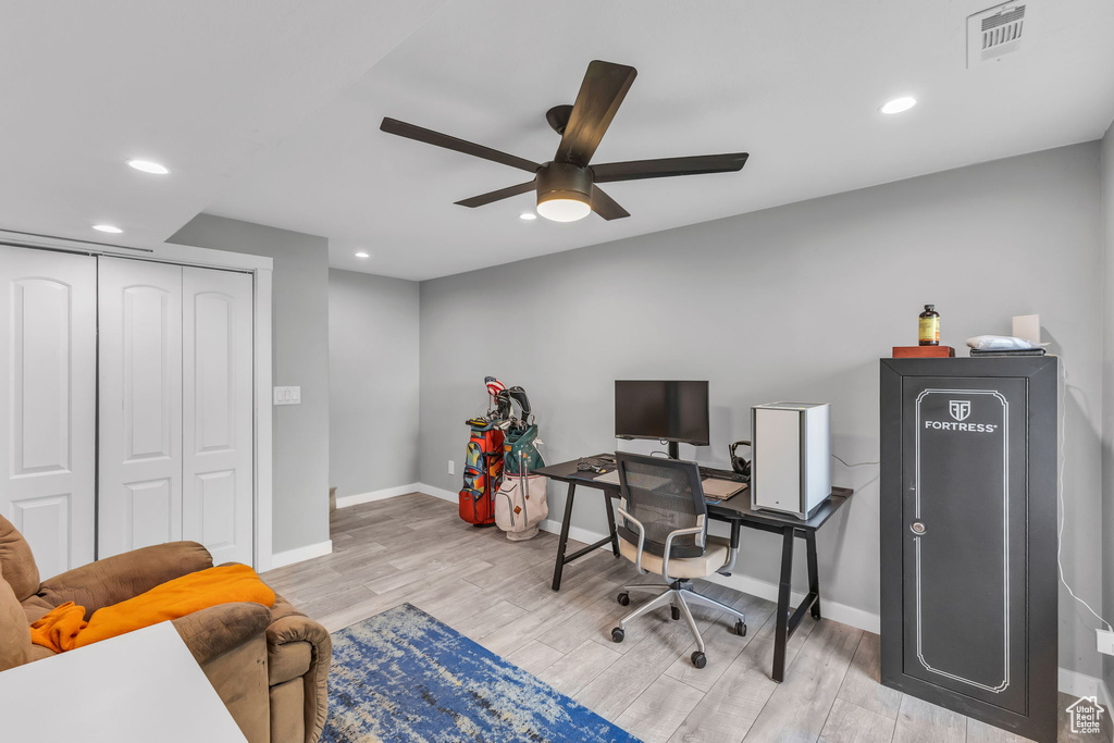 Office space with a ceiling fan, light wood-style floors, recessed lighting, and baseboards