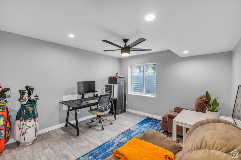 Home office featuring a ceiling fan, wood finished floors, recessed lighting, and baseboards