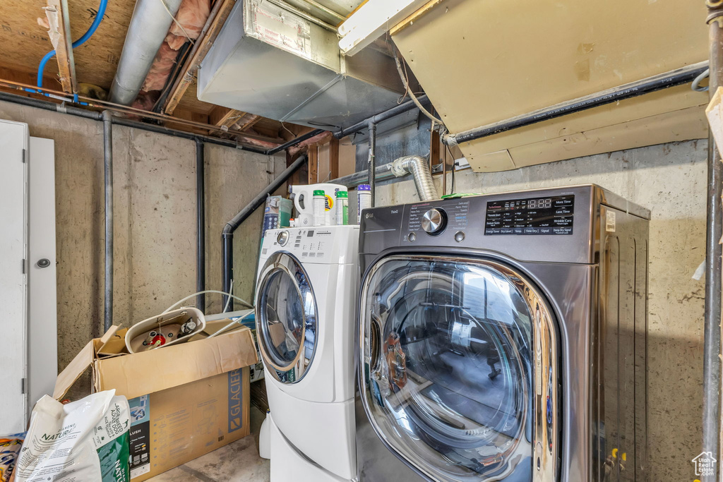 Laundry area with washer and clothes dryer