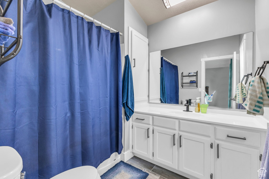 Bathroom with toilet and vanity
