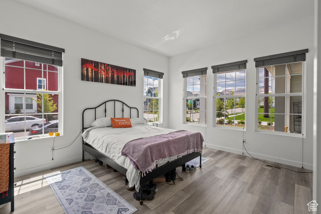 Bedroom with wood finished floors