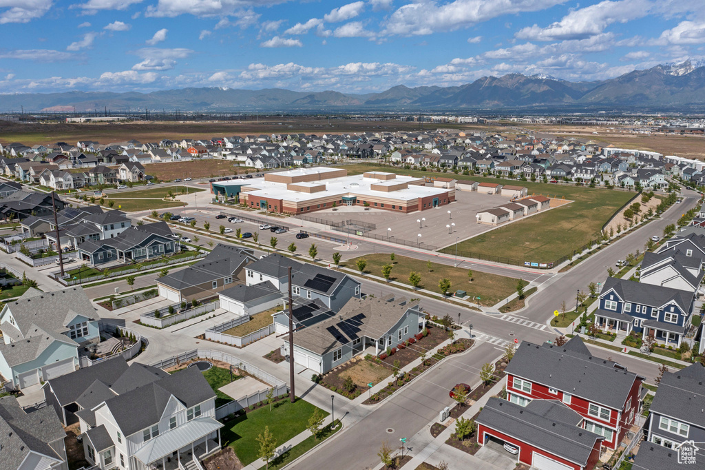Aerial perspective of suburban area featuring a mountain backdrop